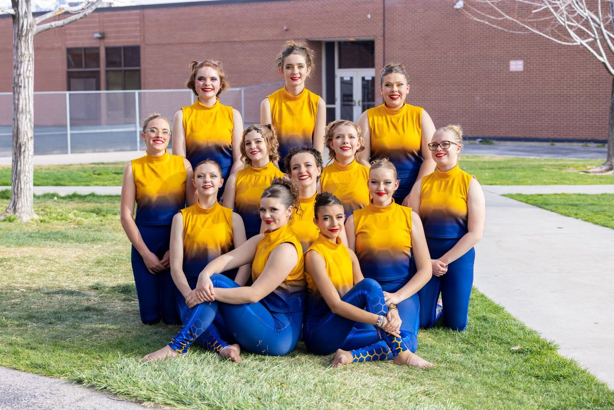 Lone Peak Color Guard varsity team in yellow and blue uniforms