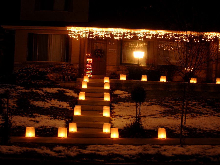 Rows of glowing luminaires lining a walkway and steps